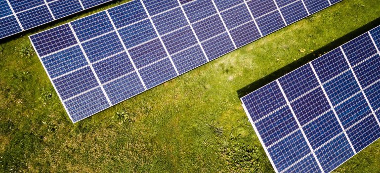 Three solar panels on the grass